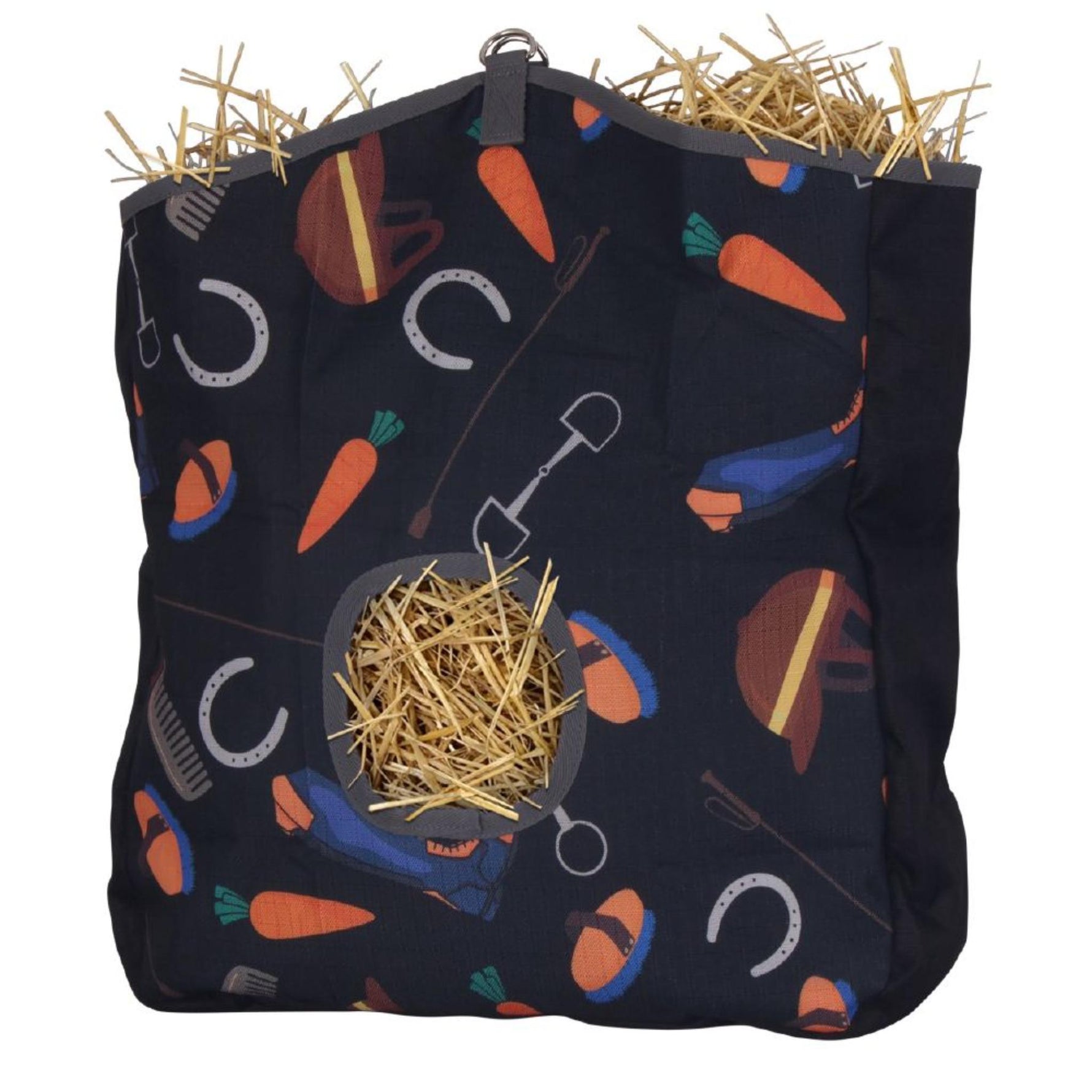 A hanging horse hay net with a navy blue fabric body printed with carrots, horseshoes, and equestrian tools, filled with hay and shown against a white background.