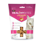 VetIQ Healthy Bites Urinary Care cat food in a resealable pouch, featuring a white and magenta design with a picture of a white cat and a window showing the brown kibble inside.