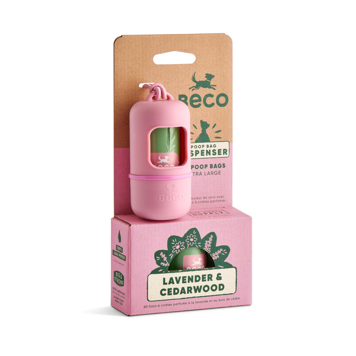 A pink Reco poop bag dispenser with a floral clip, shown in front of its brown cardboard backing card and pink retail box labeled Lavender & Cedarwood.