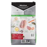 A bag of BlackHawk Original dog food, Master of the Feast variety, featuring a white and gray packaging design with a green band, showing ingredients like chicken, carrots, and fish on the back panel.