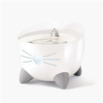White pet water bowl with cat design on a white background