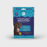 Package of fish and lamb balanced meal for dogs on a white background