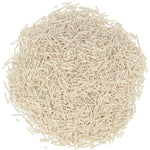 A pile of light beige rectangular plastic pellets or granules, photographed from above on a plain white background.