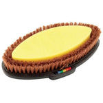 An oval horse grooming brush with a bright yellow sponge on the front, brown bristles, and a black handle with a small rainbow-colored adjustment dial, shown on a white background.